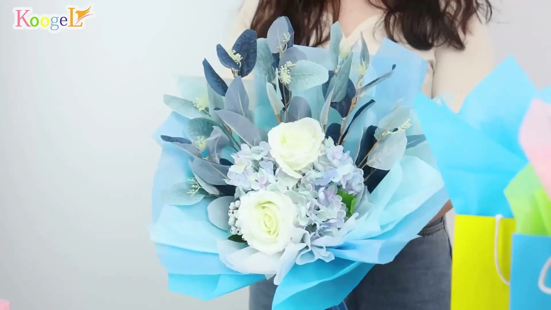 Flowers wrapped in blue Koogel tissue paper